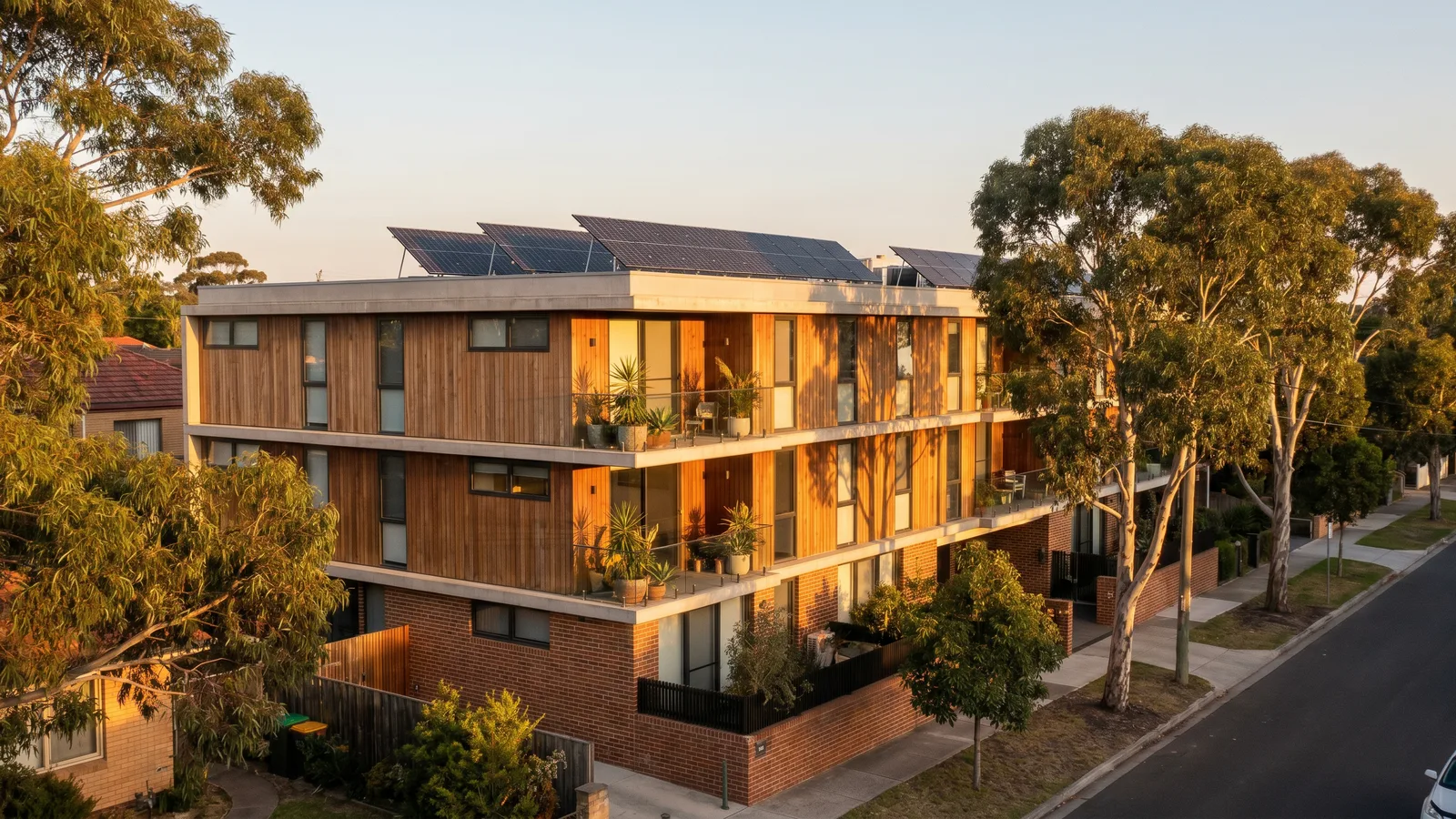 A modern Australian apartment building with rooftop solar