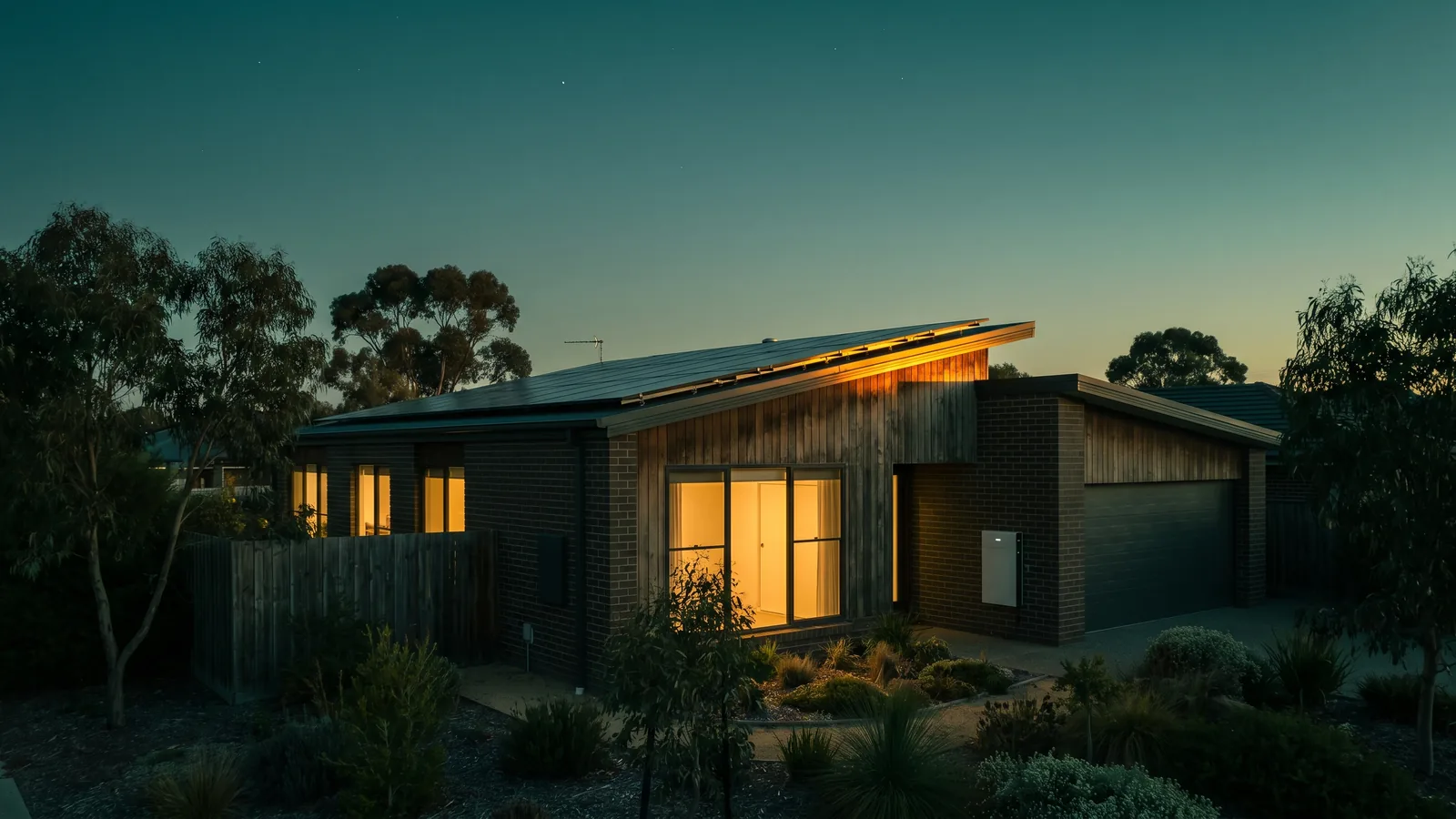 Australian home at dusk with solar catching the last gold light